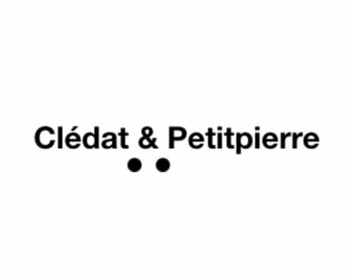 Texte "Clédat & Petitpierre" avec deux points noirs en dessous sur fond blanc, incarnant un design épuré. Limbus Studio