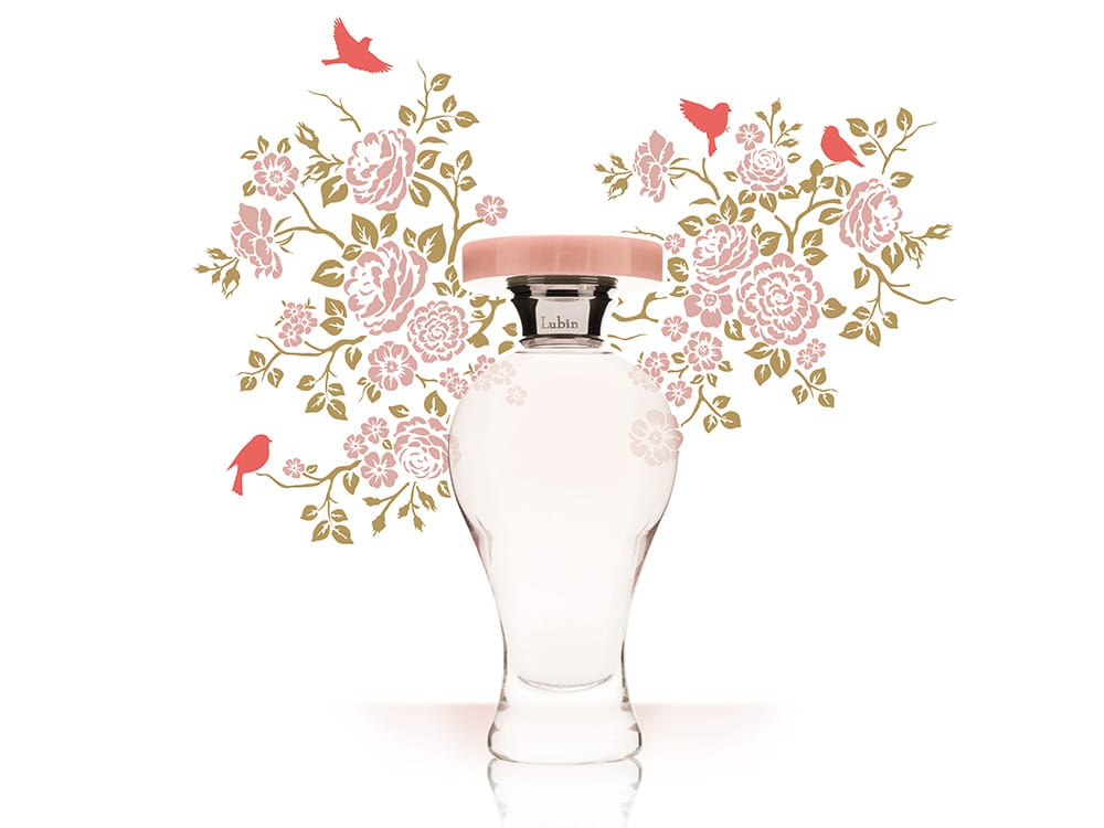 Un élégant flacon de parfum avec un bouchon rose, rehaussé de motifs floraux et d'oiseaux exquis en arrière-plan, incarne un design sophistiqué proche de l'élégance trouvée sur les thèmes WordPress.